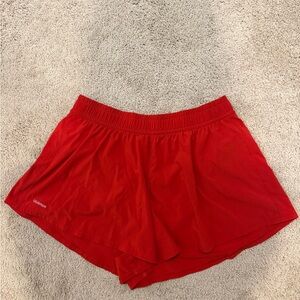 Lululemon Athletica Pace Crush High Rise 2.5” Shorts in color Dark Red; size L